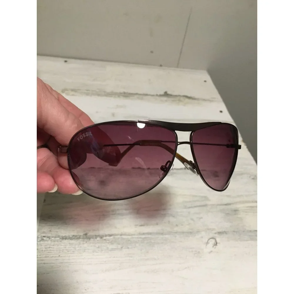 Fossil unisex aviator sunglasses with dark brown lenses and bronze frames